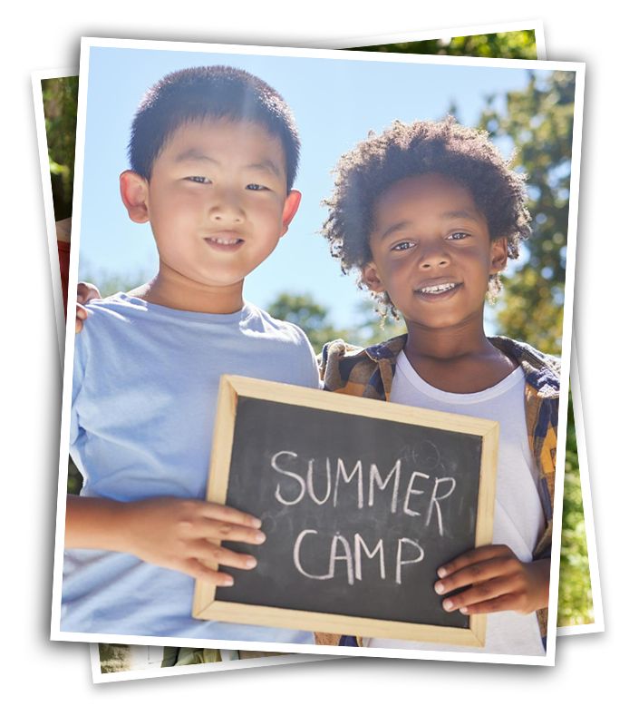 two campers holding chalkboard sign that reads "Summer Camp"