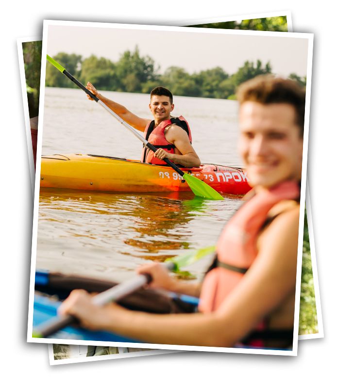 teens having fun paddling kayaks