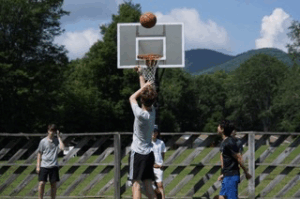 Campers shooting basketball