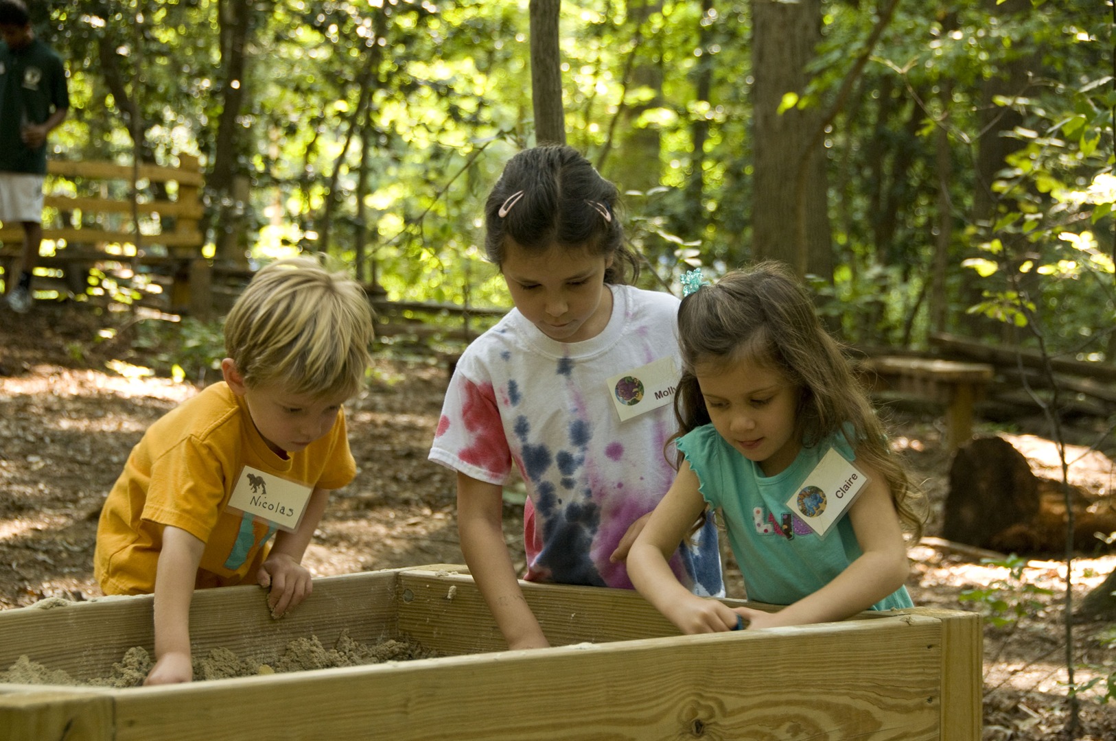 Kids play in nature box at Hidden Oaks Nature Center
