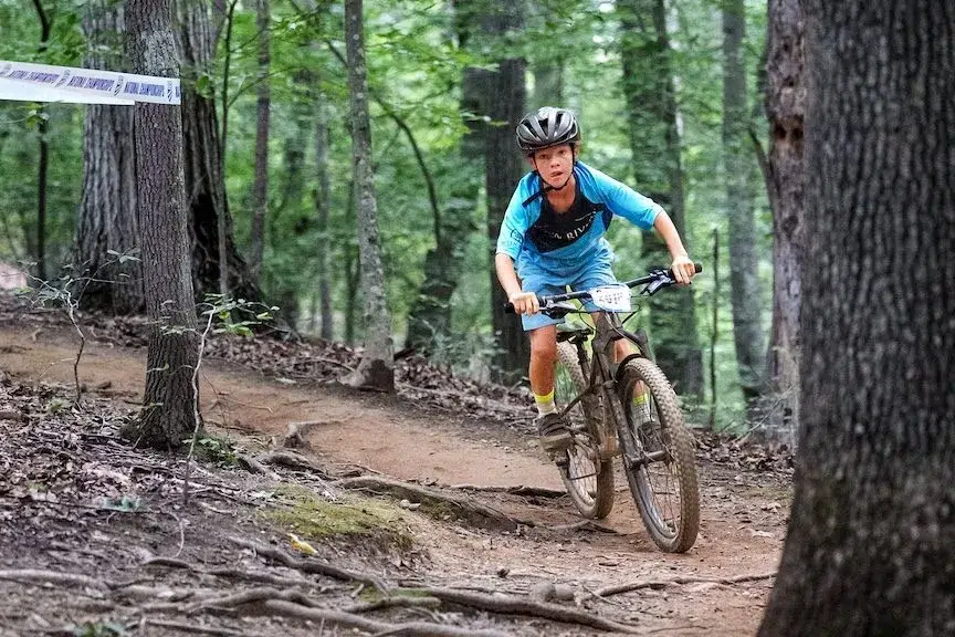 boy on mountain bike trail
