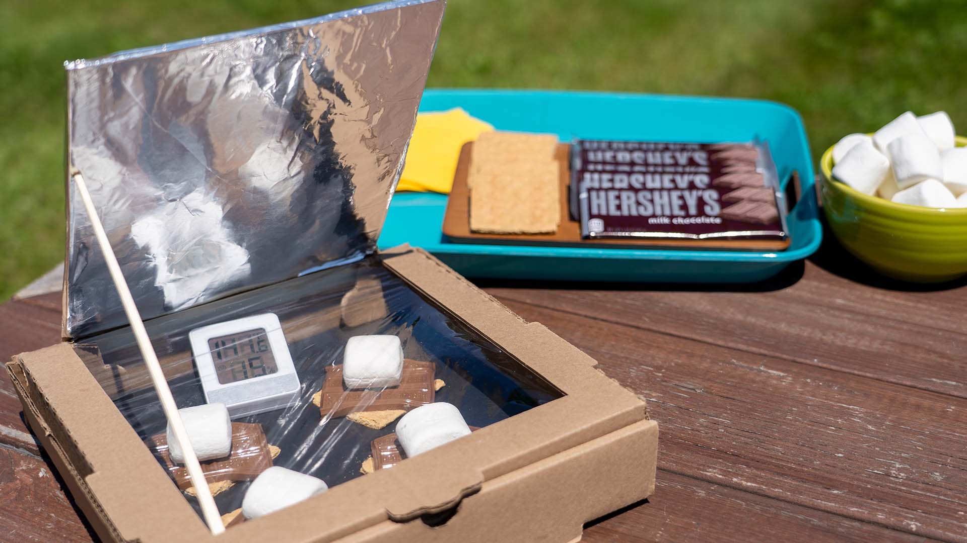 cardboard and foil solar powered oven cooking smores